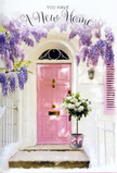 A softly coloured Belgravia doorway is captured here as a poetic welcome to a new home, with a gentle pink door standing beneath a trailing veil of wisteria. The blossoms fall in airy strands of lavender and pale purple, forming a natural frame that softens the structured geometry of the townhouse's whitewashed façade. Light skims across the walls and a single pastel shutter, creating a play of highlight and shadow that feels characteristic of the quiet streets near Eaton Place on a calm afternoon. At the foot of the doorway, a grey florist's bucket holds a generous bouquet of white and cream roses, each bloom open and full, their petals overlapping in plush concentric circles. Subtle green foliage nestles among the roses, giving the arrangement depth and a whisper of garden freshness, like foliage cut from a well-tended Belgravia balcony. Around the bucket, a pink ribbon is tied in a lovely, understated bow, its tone perfectly echoing the door's hue and knitting the entire entryway into a cohesive pastel story. The stone steps show a faint patina, hinting at daily life, yet for this moment they serve as a small stage for the flowers alone. The light, likely late afternoon, lingers gently on the roses, enhancing their creamy tones and inviting the viewer to imagine the fragrance drifting up as someone approaches with keys in hand. This feels like a carefully considered housewarming gesture, perhaps delivered by Florists Belgravia as a personal touch for a new arrival to the neighbourhood. The mood is tender, hopeful, and quietly luxurious, expressing with roses and wisteria what words often struggle to say: heartfelt congratulations and a warm, enduring welcome home.