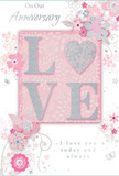 The anniversary card pictured here offers a gentle tribute to enduring romance, its design as soft and composed as an early evening walk around Belgravia's elegant terraces. The primary colour palette blends tender pastel pinks with silvery greys and clean whites, creating an atmosphere of intimacy and calm. At the centre, the word LOVE is formed from raised letters touched with fine glitter, each character distinct yet harmoniously aligned. The letter O is reimagined as a shimmering silver heart, slightly more pronounced in its sparkle, becoming both letter and symbol at once. The glitter is smooth and evenly applied, inviting fingers to linger over the curved surface, providing a discreet tactile highlight. Around this central emblem, clusters of delicate blossoms unfold in blush and muted mauve, their outlines softened as if brushed with watercolour. Petals are layered and subtly shaded, accompanied by slender vines, looping tendrils, and tiny butterflies or fluttering petals that suggest motion and joyful energy. These details feel almost like the sketch of a romantic bouquet waiting to be arranged in a Belgravia townhouse. The text On Our Anniversary sits near the top or centre in an understated, elegant script, while I love you today and always appears nearby in a matching hand, the letters fine and slightly flowing, like a line from a cherished love note. Generous negative space prevents the design from feeling crowded, allowing the eye-and the heart-to rest. The overall impression is of a card that mirrors a carefully chosen bouquet from Florists Belgravia: soft-spoken, deeply heartfelt, and perfectly suited to marking another year of shared stories and quiet companionship.